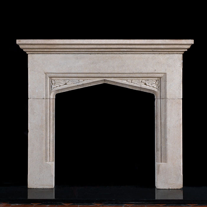 A limestone Tudor style fireplace surround   