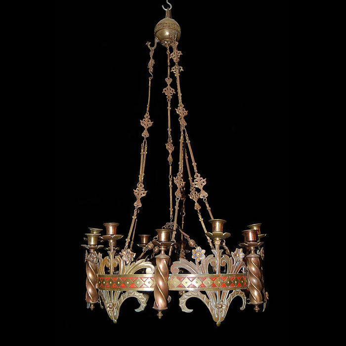 An antique Gothic Revival eight light brass chandelier