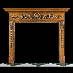 A Carved Pine Georgian Style Chimneypiece 
