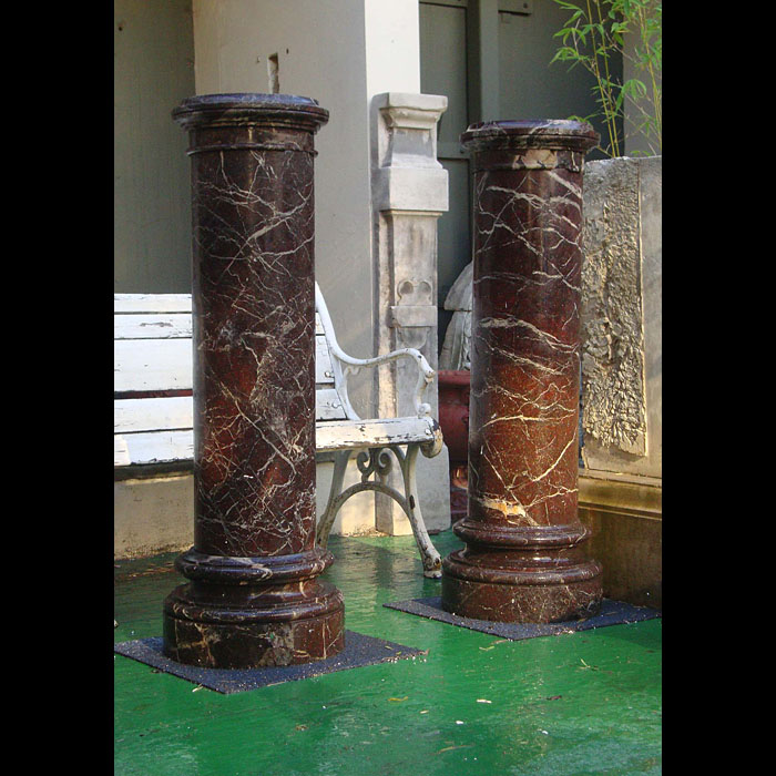  Pair of red marble columns with revolving tops
