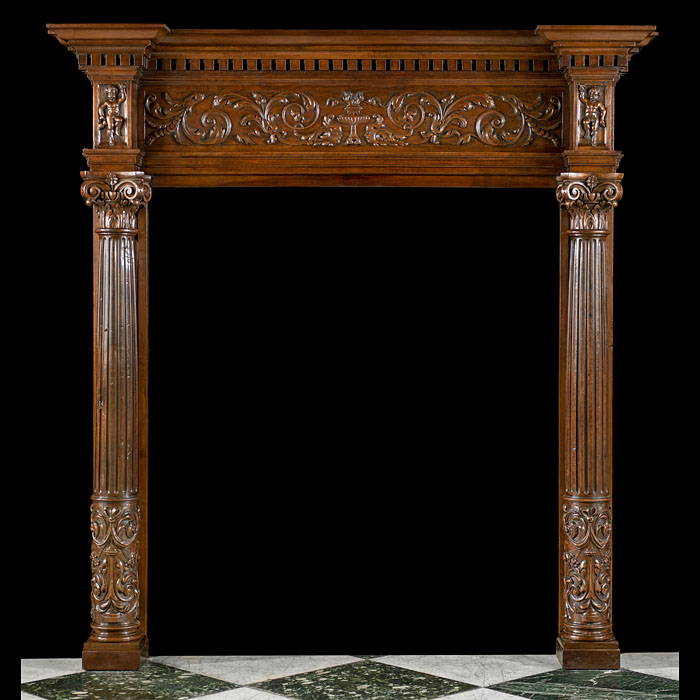 A Walnut Italian Renaissance Style Fireplace
