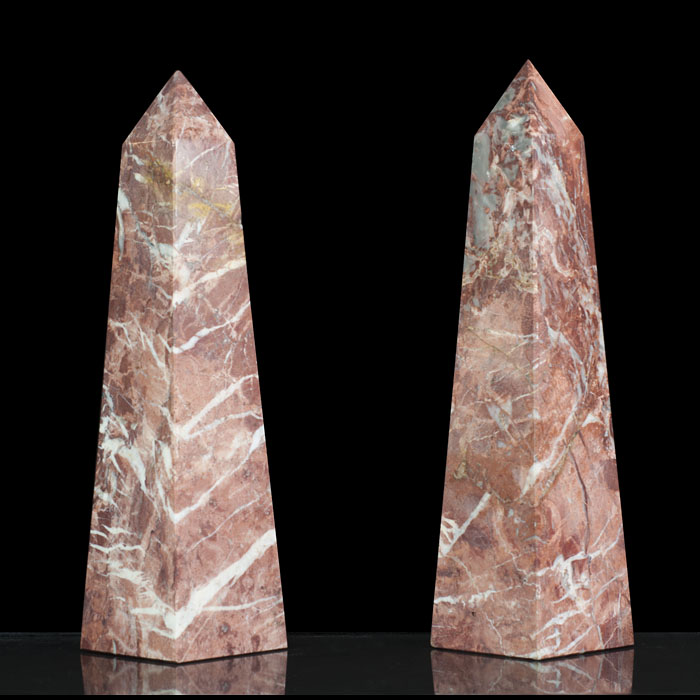 A pair of small Rouge Royal Marble obelisks