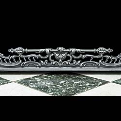 An ornate cast iron early Victorian antique fireplace fender 