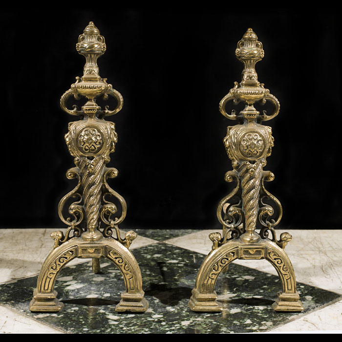 A pair of Renaissance style brass andirons