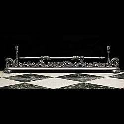 An Antique Victorian cast iron and steel fireplace fender 