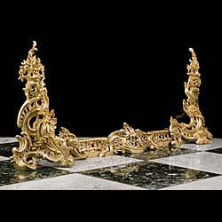 An antique French gilt bronze fireplace fender in the Rococo style 