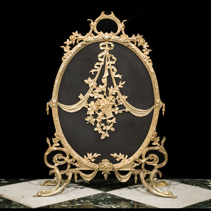 A large French brass Rococo firescreen.