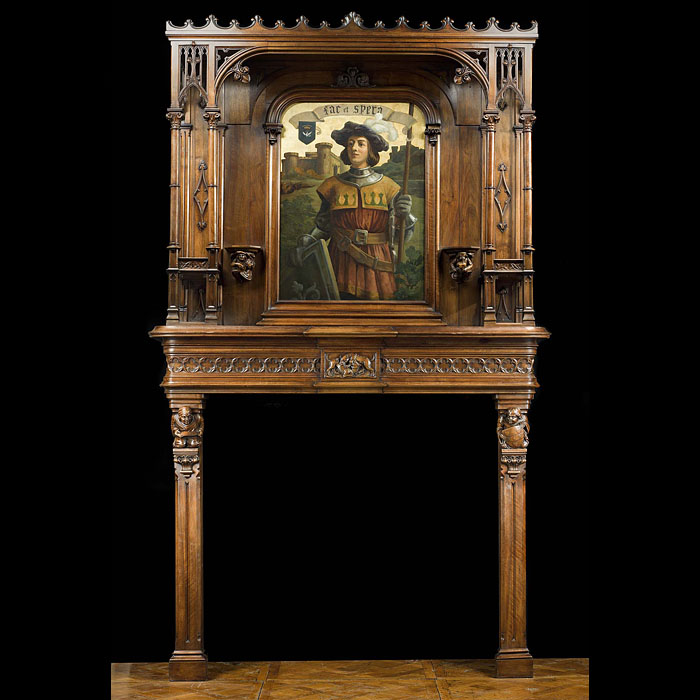A carved walnut Gothic Revival fireplace and over mantel