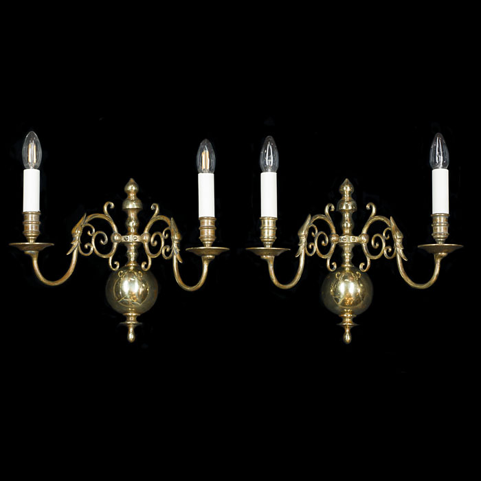 A pair of Baroque style brass wall lights