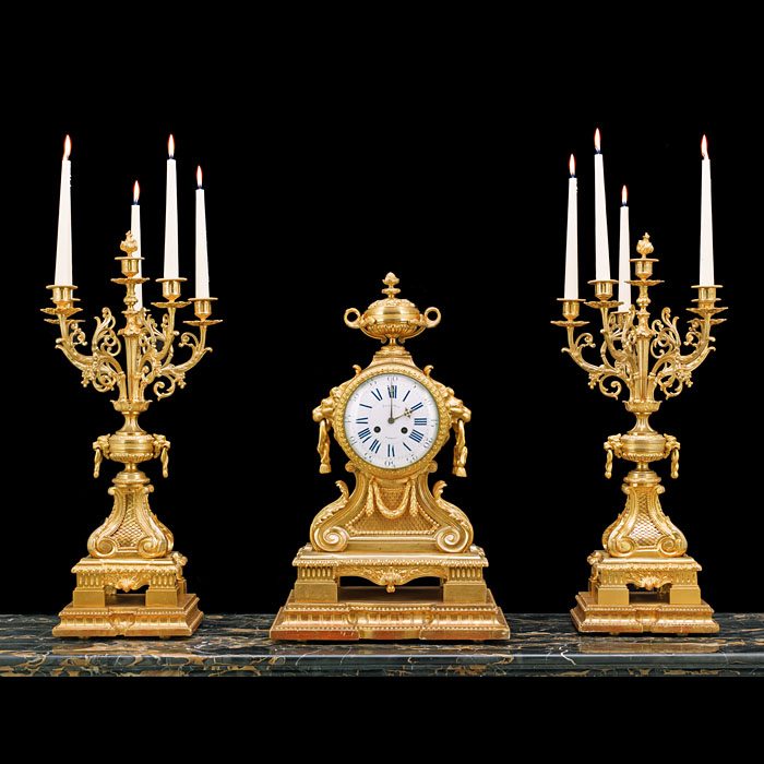 A Grand Gilt Bronze Antique Clock Garniture