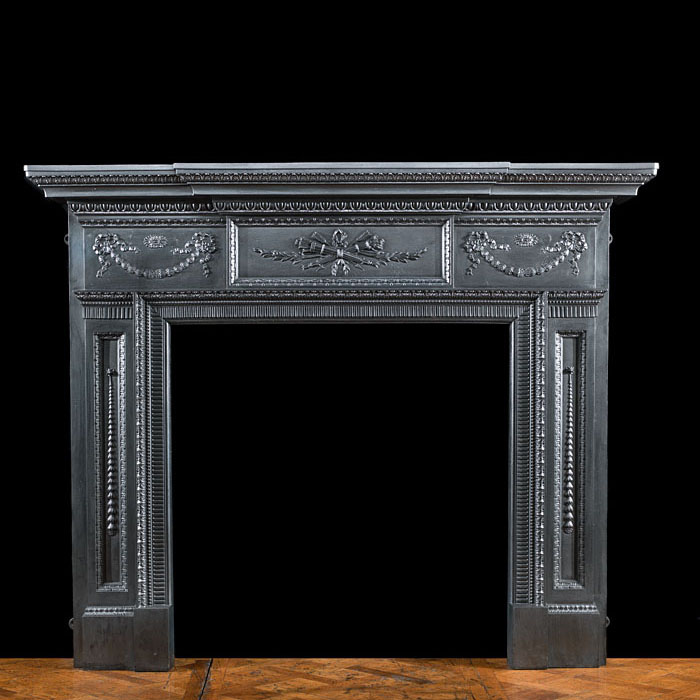 A large cast iron Victorian fire surround