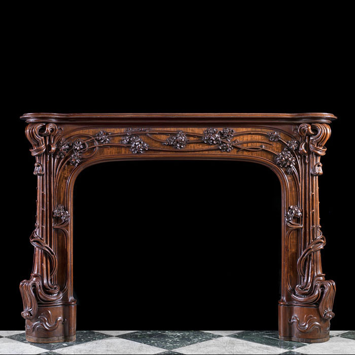 A rare walnut Art Nouveau fire surround 