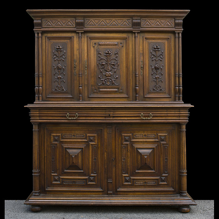A French antique carved walnut cupboard