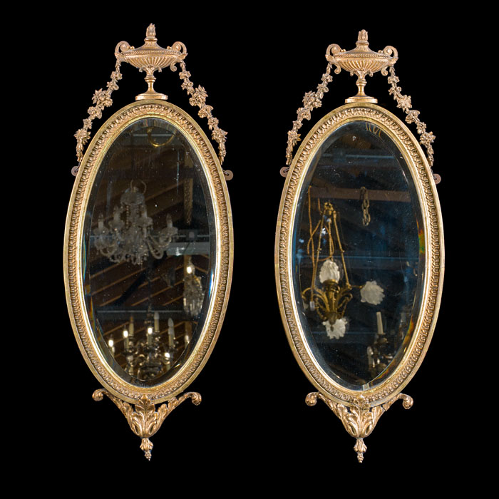 A Pair of Oval Gilt Gesso Wall Mirrors 