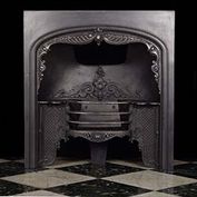 11503: A PRETTY AND DECORATIVE CAST IRON MID VICTORIAN  Register Grate with a bow fronted basket & attractive varied scrolled acanthus and other decoration. Circa 1850

