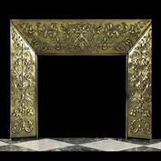 11805: A RARE, ORNATE BRASS FIREPLACE INSERT  in the Italian Renaissance manner, the design incoporating scrolled floral and Satyr masks, French 19th century.

  Link to: Antique Fire grates and Register gra