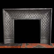 12069: A LOUIS XVI DECORATIVE CAST IRON FIREPLACE INSERT, with pretty floral motif detail. French mid to late 19th century.