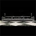 A Rococo style steel and cast iron antique fireplace fender.